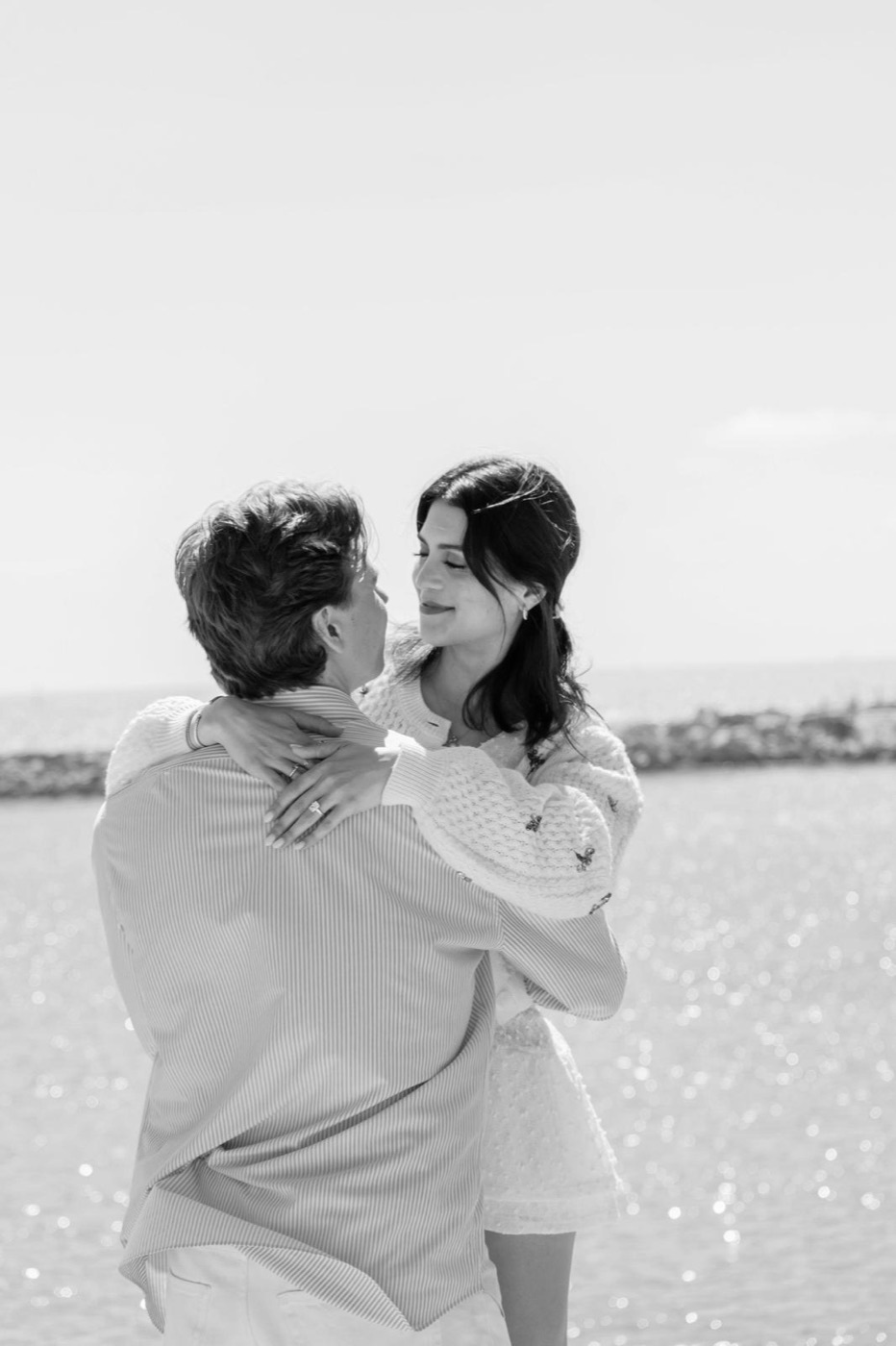 Henri and Lorena Paola embracing by the sea